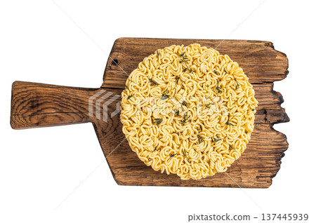Twisted raw ramen noodles, ready to soak up flavors and bring warmth to your next culinary adventure. isolated on white background. top view 137445939