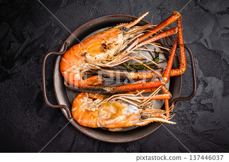 Succulent grilled rosenbergii prawn shrimp, perfectly charred and bursting with flavor, ideal for seafood lovers. black background. top view Succulent grilled rosenbergii prawn shrimp, perfectly charred and bursting with flavor, ideal for seafood lovers. black background. top view 137446037