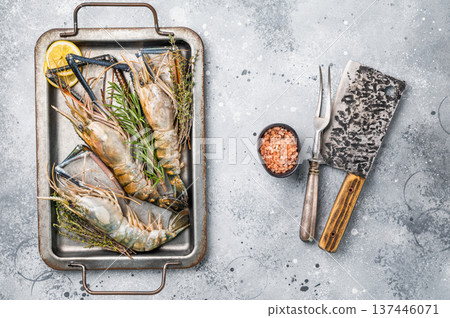 Freshly caught raw rosenbergii prawn displayed elegantly, highlighting their natural beauty and premium quality. grey background. top view Freshly caught raw rosenbergii prawn displayed elegantly, highlighting their natural beauty and premium quality. grey background. top view 137446071