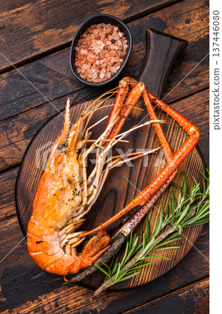Juicy grilled giant river prawn shrimp served with rosemary, a mouthwatering dish for your next barbecue. wooden background. top view Juicy grilled giant river prawn shrimp served with rosemary, a mouthwatering dish for your next barbecue. wooden background. top view 137446080