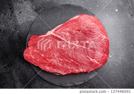 Fresh raw top sirloin steak, beautifully marbled and ready for grilling, perfect for meat lovers seeking quality. black background. top view Fresh raw top sirloin steak, beautifully marbled and ready for grilling, perfect for meat lovers seeking quality. black background. top view 137446091