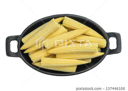 Whole uncooked baby corn in cast iron pan oisolated n white backdrop perfect for cooking preparation concepts Whole uncooked baby corn in cast iron pan oisolated n white backdrop perfect for cooking preparation concepts 137446108