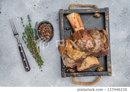 Juicy beef shank ossobuco slow cooked with marrow bone thyme top view copy space 137446238