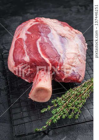 Fresh raw beef shank knuckle joint with bone and spices flat lay butcher cut on textured dark surface 137446251