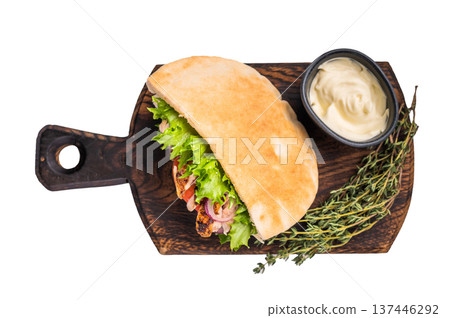 Doner kebab with grilled chicken meat, salad, tomato, onion in pita bread isolated on white background 137446292