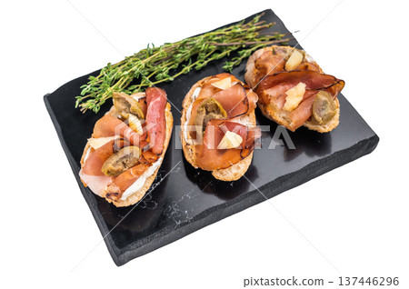 Prosciutto and pesto bruschetta, parmesan cheese and olives isolated on white background. top view Prosciutto and pesto bruschetta, parmesan cheese and olives isolated on white background. top view 137446296