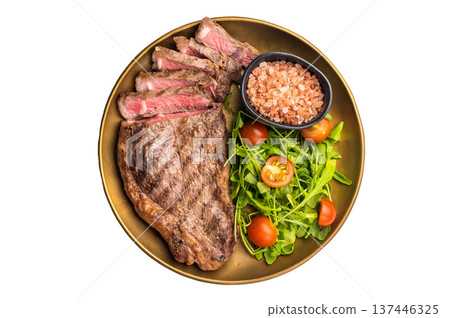 Grilled New York strip steak, beef meat steak on a plate with salad isolated on white background 137446325