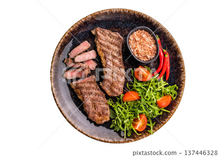 BBQ Grilled skirt or machete Steak, beef meat on a plate with salad isolated on white background BBQ Grilled skirt or machete Steak, beef meat on a plate with salad isolated on white background 137446328