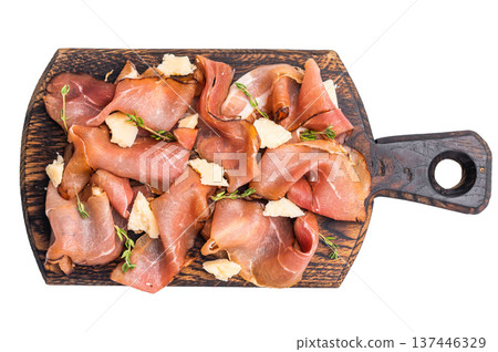 Italian Prosciutto parma ham with herbs and parmesan cheese on wooden board isolated on white background. top view Italian Prosciutto parma ham with herbs and parmesan cheese on wooden board isolated on white background. top view 137446329