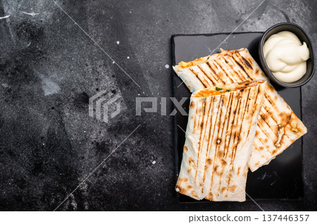 Oriental Doner kebab wrap, Shawarma with beef meat and salad. black background. top view 137446357