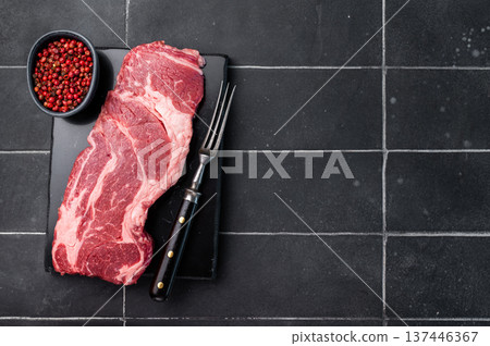 Raw Chuck eye roll steak, fresh prime beef meat. black background. top view Raw Chuck eye roll steak, fresh prime beef meat. black background. top view 137446367