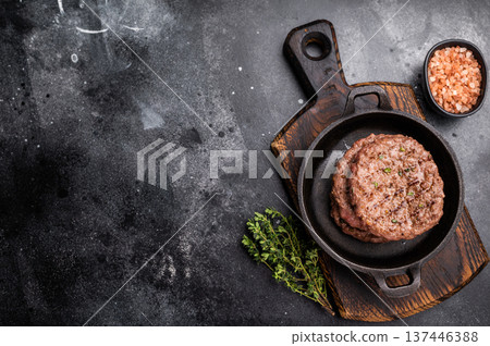 Grilled hamburger beef meat patties, chooped roast meat. black background. top view 137446388