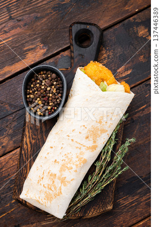 Seafood Shawarma wrap with shrimps, prawns and veggies. wooden background. top view Seafood Shawarma wrap with shrimps, prawns and veggies. wooden background. top view 137446389