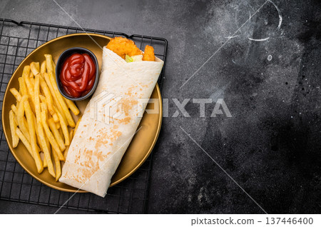 Doner kebab with shrimps, prawns, salad and french fry. black background. top view 137446400
