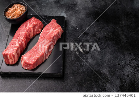 Raw Tri Tip Steak from Black Angus beef meat . black background. top view 137446401