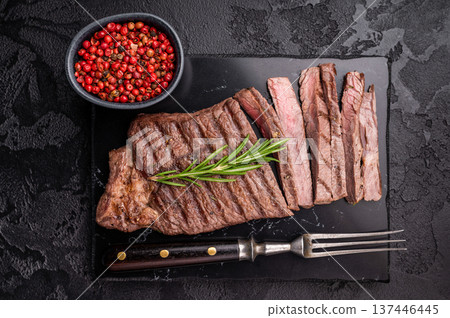 Grilled medium beef Rump steak on marble board. black background. top view 137446445