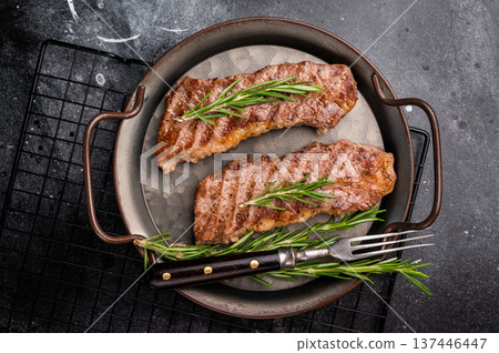 BBQ roast marbled beef Steak, beef meat on tray with herbs. black background. top view 137446447