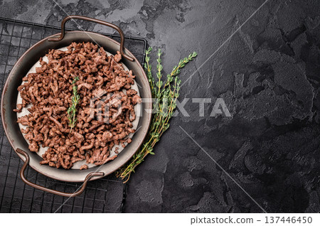 Fried mince beef and pork meat, fresh cooked mincemeat. black background. top view 137446450