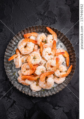 A plate of shrimp. The shrimp are arranged in a circular pattern, with some of them overlapping each other. The dish looks appetizing and inviting. A plate of shrimp. The shrimp are arranged in a circular pattern, with some of them overlapping each other. The dish looks appetizing and inviting. 137446492