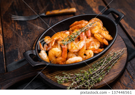 Deliciously seasoned grilled shrimp prawns with vibrant colors, a must-have for seafood lovers and culinary enthusiasts. wooden background. top view Deliciously seasoned grilled shrimp prawns with vibrant colors, a must-have for seafood lovers and culinary enthusiasts. wooden background. top view 137446561