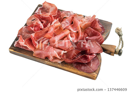 Italian charcuterie mix with prosciutto, coppa and bresaola arranged on a rustic wooden board, photographed close up on a light background. Italian charcuterie mix with prosciutto, coppa and bresaola arranged on a rustic wooden board, photographed close up on a light background. 137446609