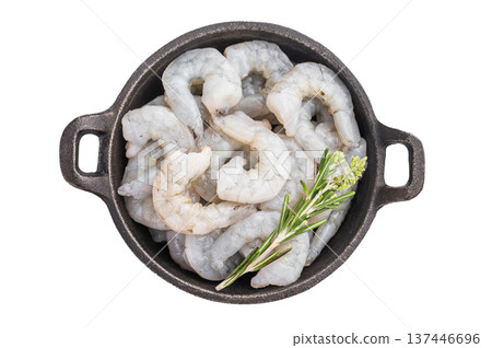 Uncooked prawns shrimps in a skillet ready for a healthy meal. Top view of seafood with herbs on a white background. Uncooked prawns shrimps in a skillet ready for a healthy meal. Top view of seafood with herbs on a white background. 137446696