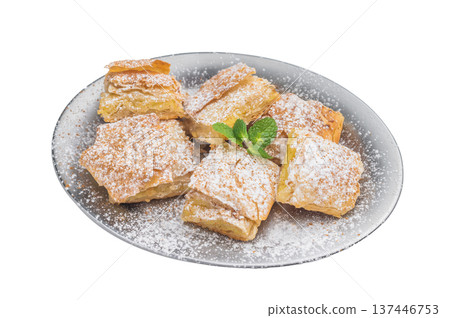 Greek custard pie made with flaky filo pastry also known as milk pie sliced and served on plate with powdered sugar Greek custard pie made with flaky filo pastry also known as milk pie sliced and served on plate with powdered sugar 137446753