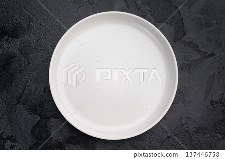 Minimal empty plate on dark background with texture. Modern ceramic tableware mockup with copy space Minimal empty plate on dark background with texture. Modern ceramic tableware mockup with copy space 137446758