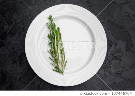 Empty porcelain plate with rosemary on dark texture. Modern food presentation with copy space Empty porcelain plate with rosemary on dark texture. Modern food presentation with copy space 137446764