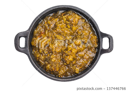Green pickle relish made from cucumbers in cast iron skillet on isolated background top view with copy space 137446766