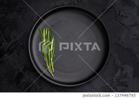 Empty black plate top view on dark textured background. Minimal luxury tableware mockup with copy space 137446793
