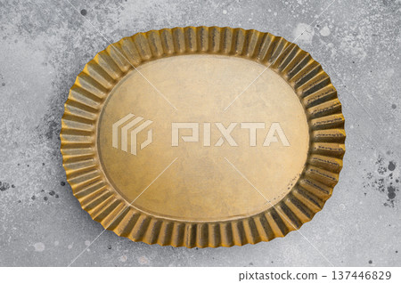 Antique style oval brass plate overhead. Decorative metal tableware with copy space Antique style oval brass plate overhead. Decorative metal tableware with copy space 137446829