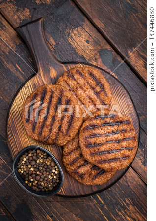 Vegetarian grilled burger patties plant based meat substitute high protein cruelty free food rustic dark background 137446830