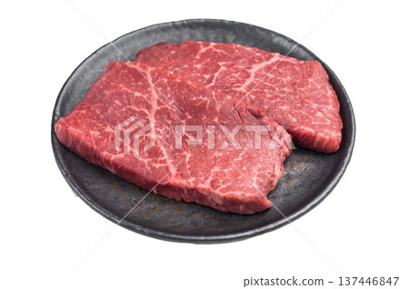 Raw premium beef steak flatiron top blade cut on dark plate top view fresh red meat ingredient for steakhouse cuisine 137446847