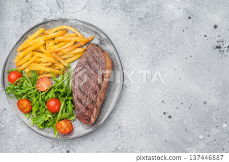 Juicy grilled beef culotte steak with potatoes and arugula salad, sirloin cap cut served for lunch or dinner Juicy grilled beef culotte steak with potatoes and arugula salad, sirloin cap cut served for lunch or dinner 137446887