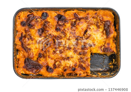 Baked beef lasagna bolognese in baking dish with melted cheese and served slice top view on isolated background copy space Baked beef lasagna bolognese in baking dish with melted cheese and served slice top view on isolated background copy space 137446908