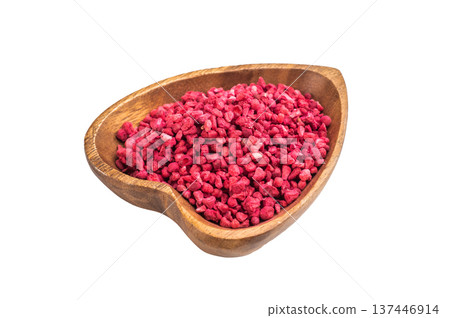 Freeze dried raspberry granules in wooden bowl isolated on white background. Natural vibrant berry texture flatlay Freeze dried raspberry granules in wooden bowl isolated on white background. Natural vibrant berry texture flatlay 137446914