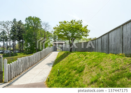 The east gate and wooden fence of the historic castle in Hachinohe, a historical park that faithfully recreates a medieval castle The east gate and wooden fence of the historic castle in Hachinohe, a historical park that faithfully recreates a medieval castle 137447175