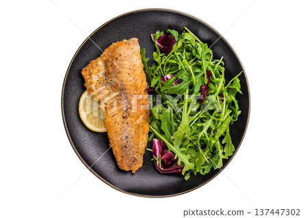 Roasted Haddock fish fillet on a plate with salad isolated on white background. top view 137447302