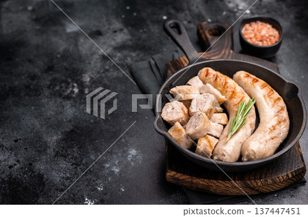 Fried BBQ Sausages with pork and beef meat in pan. black background. top view Fried BBQ Sausages with pork and beef meat in pan. black background. top view 137447451