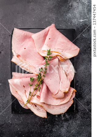 Thinly Sliced Pork Ham Prosciutto Cotto. black background. top view 137447454