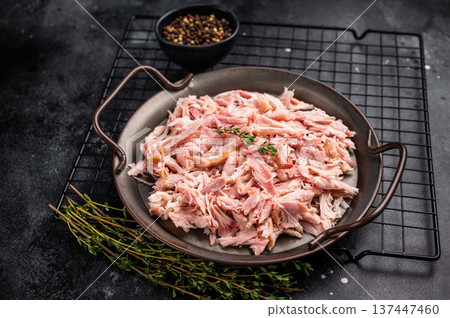 Hot smoked Pulled Chicken meat, cooked poultry in a tray. black background. top view 137447460