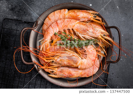 Red Argentine shrimps, raw Prawns Langostino Austral in steel tray. black background. top view Red Argentine shrimps, raw Prawns Langostino Austral in steel tray. black background. top view 137447500