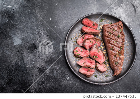 Grilled lamb mutoon sliced steak, tenderloin fillet meat. black background. top view 137447533