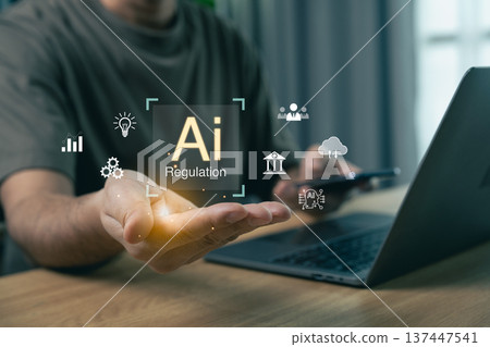Person presenting AI regulation concept with glowing digital icons over open hand, modern tech compliance Person presenting AI regulation concept with glowing digital icons over open hand, modern tech compliance 137447541