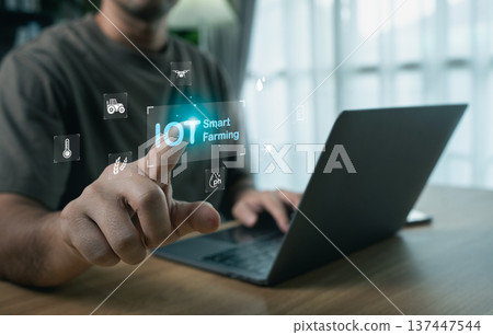 Man touching virtual IOT Smart Farming interface with digital agriculture icons, modern agritech and automation concept Man touching virtual IOT Smart Farming interface with digital agriculture icons, modern agritech and automation concept 137447544