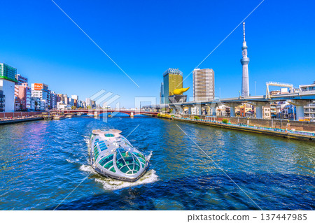 Tokyo cityscape in Japan, with views of Azumabashi Bridge, the water bus "Emeraldas," Tokyo Skytree, and more (March 8th) Tokyo cityscape in Japan, with views of Azumabashi Bridge, the water bus "Emeraldas," Tokyo Skytree, and more (March 8th) 137447985
