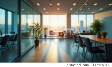Abstract office interior background. Blurry office space. Modern workspace design with plants, blurred furniture and glass walls. Natural light, commercial building, business concept. Abstract office interior background. Blurry office space. Modern workspace design with plants, blurred furniture and glass walls. Natural light, commercial building, business concept. 137448017