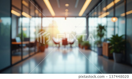 Abstract office interior background. Blurry office space. Modern workspace design with plants, blurred furniture and glass walls. Natural light, commercial building, business concept. Abstract office interior background. Blurry office space. Modern workspace design with plants, blurred furniture and glass walls. Natural light, commercial building, business concept. 137448020