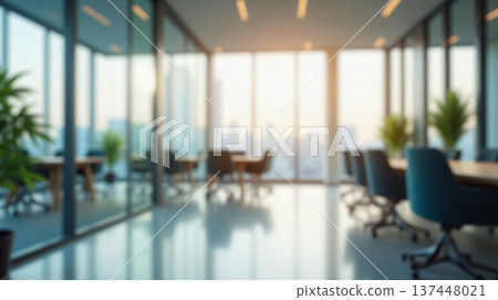 Abstract office interior background. Blurry office space. Modern workspace design with plants, blurred furniture and glass walls. Natural light, commercial building, business concept. Abstract office interior background. Blurry office space. Modern workspace design with plants, blurred furniture and glass walls. Natural light, commercial building, business concept. 137448021